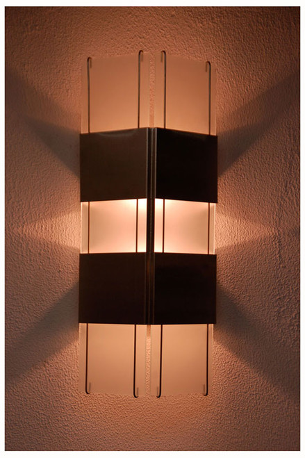 Evening view of this dynamic wall sconce.