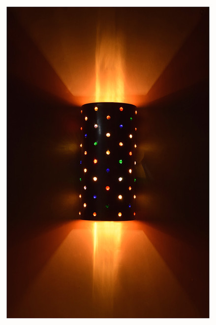 Marble wall sconce shown illuminated with two bulbs utilizing a duplex porcelain socket.