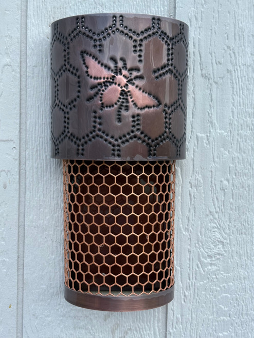Dark Antique copper with dark amber mica to replicate honey in the bee hive. This fixture can be ordered with a dark sky top for only down lighting and for wet locations. 