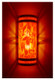 Stainless steel wall sconce with orange moire pattern diffuser