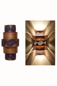 Day and Night View of the Burned Ziggurat Wall Sconce.  All the burned copper ziggurat sconces receive burned copper.  You may select the contrasting or coordinating solid metal bands to create the look that you desire.