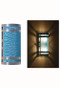 Stainless steel wall sconce with aqua moire pattern diffuser