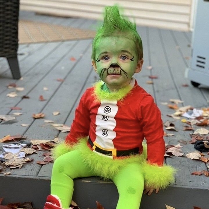 Baby dressed as the grinch