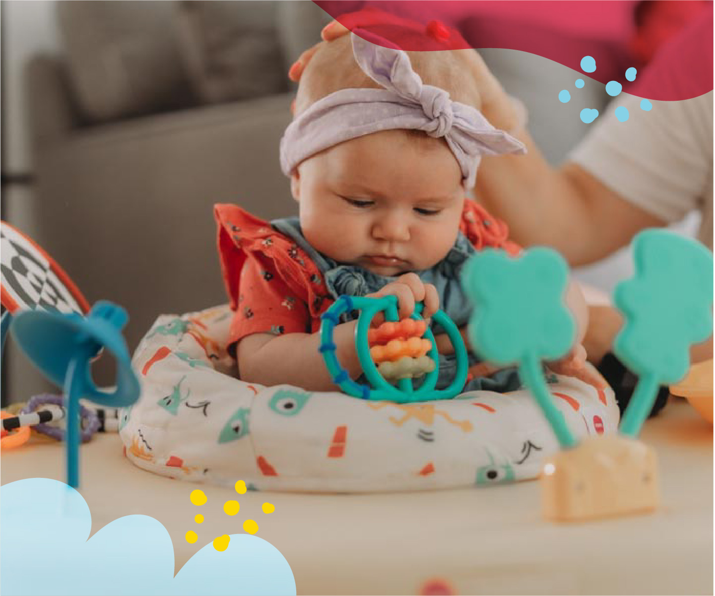 baby girl in exersaucer playing