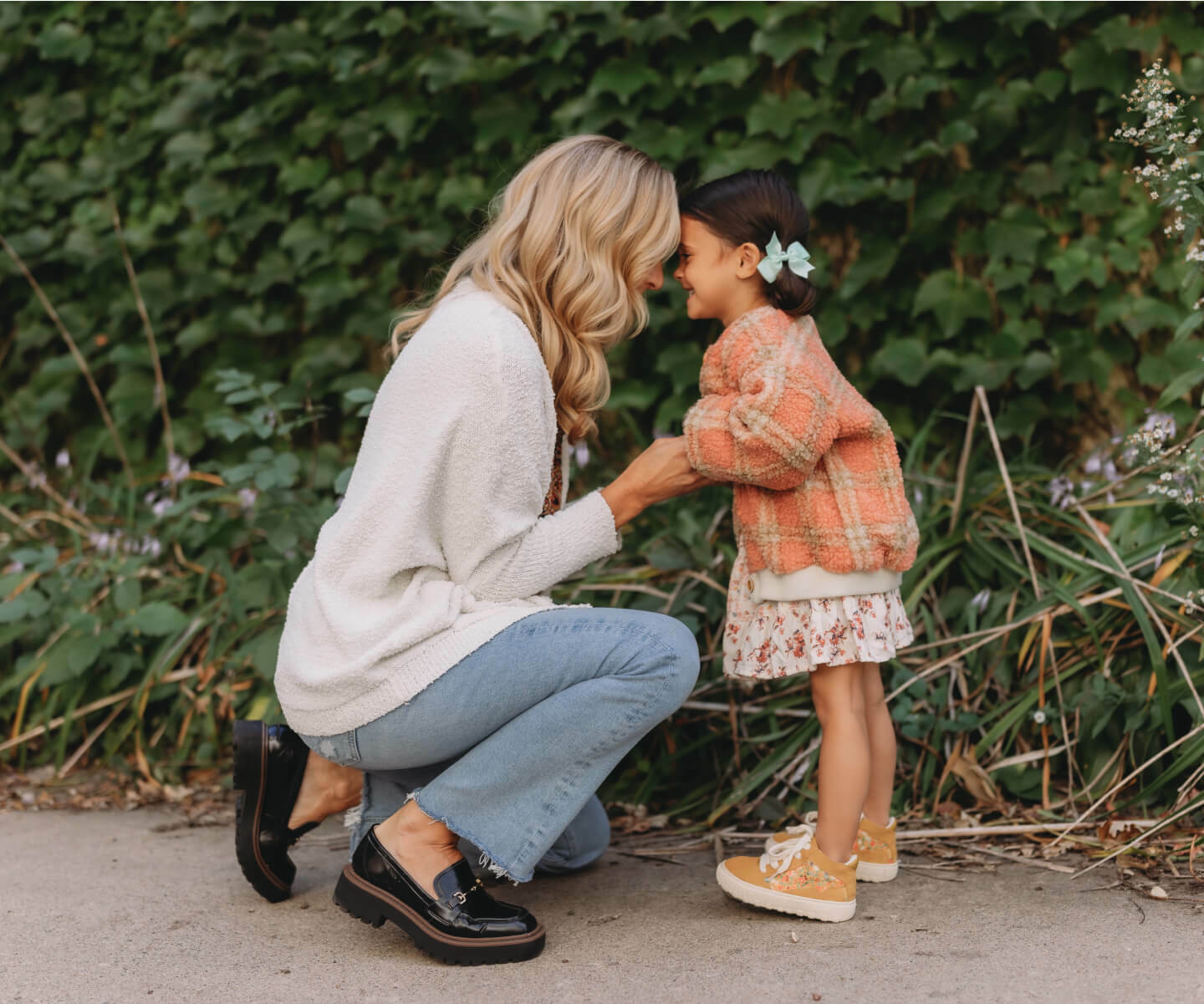 mom and daughter holding hands