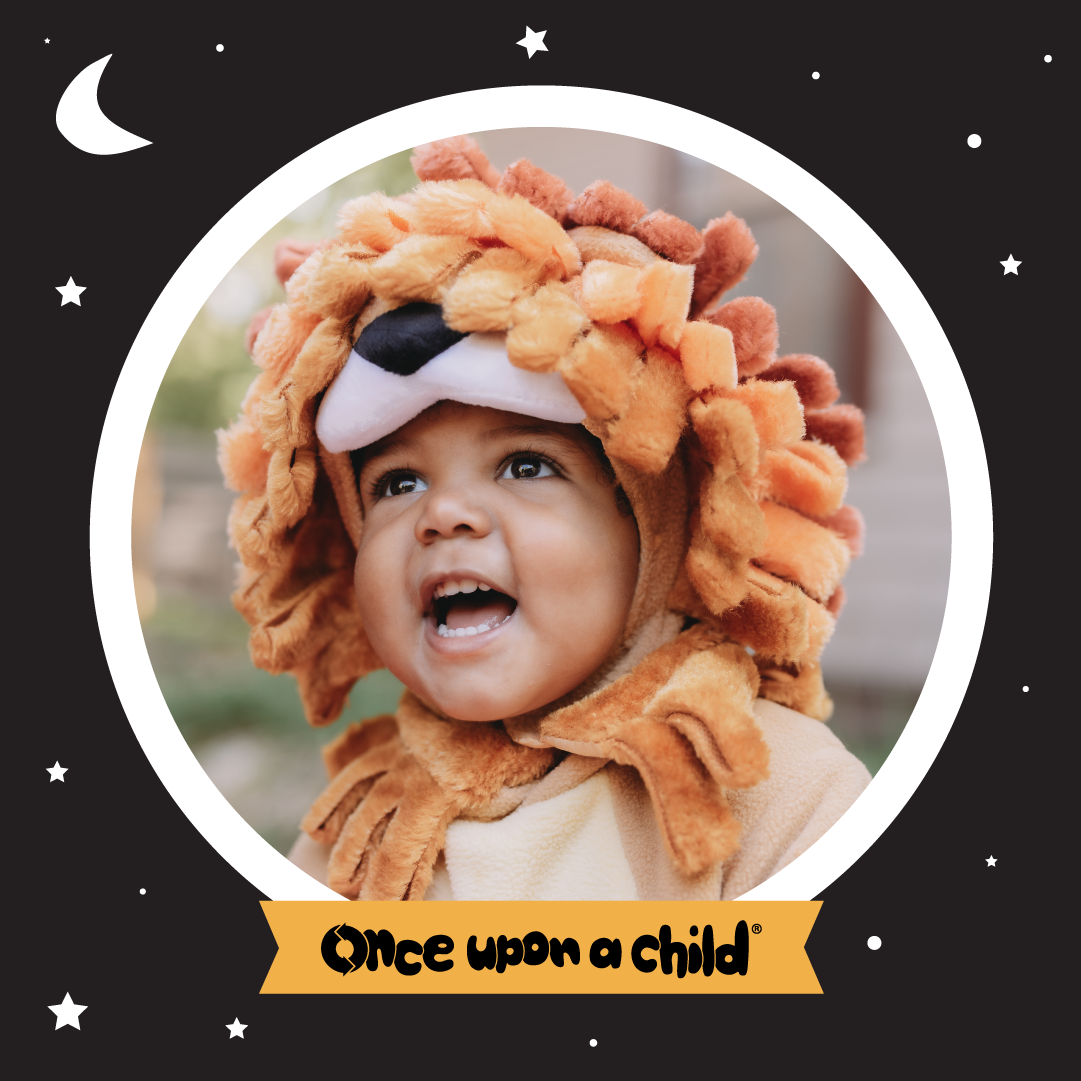 a baby wearing a halloween lion costume with the words Once Upon A Child
