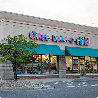 A shop facade labeled "Once Upon a Child" selling kids' apparel and toys