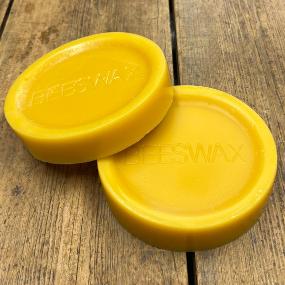 2 x 500g British Beeswax Blocks, wood background - Honeyfields Bee Farm