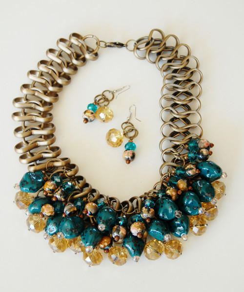 Turquoise and Crystals with Stones set off an Antique Gold Collar Chain