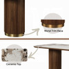 Manufacturer detail of the ceramic top and metallic trim around the pedestal bases.