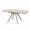 Included Bexley table shown extended, with cream-finish angled legs.