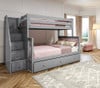 Rylan Gray Twin over Full Bunk Beds with Stairs shown with Optional Twin Storage Trundle Angled View Room