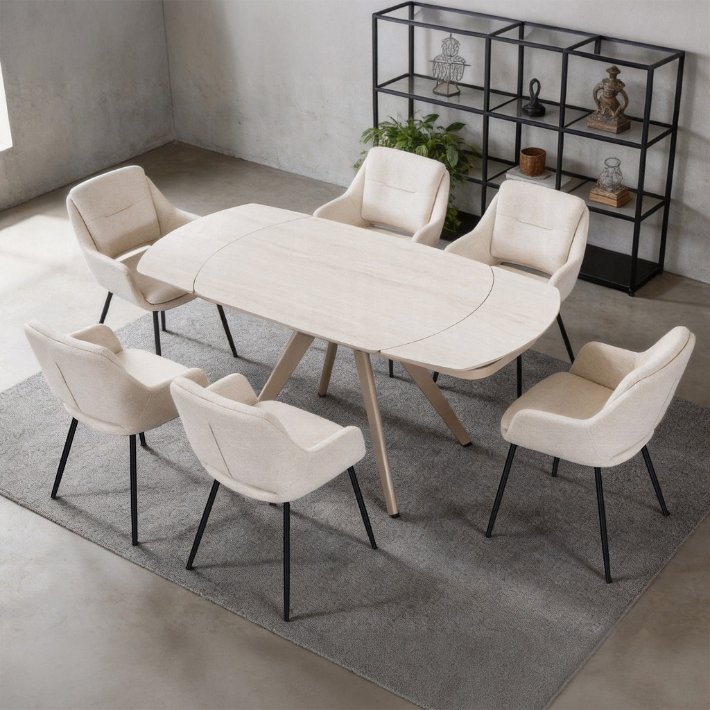 Bexley table with the included six beige armchairs in a room setting. Shelving, rug, plants and decor are not included.