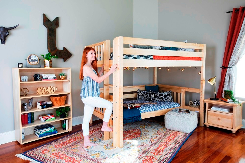 Becks Natural Queen Loft Bed with Daybed Angled View with Teen on Ladder Room