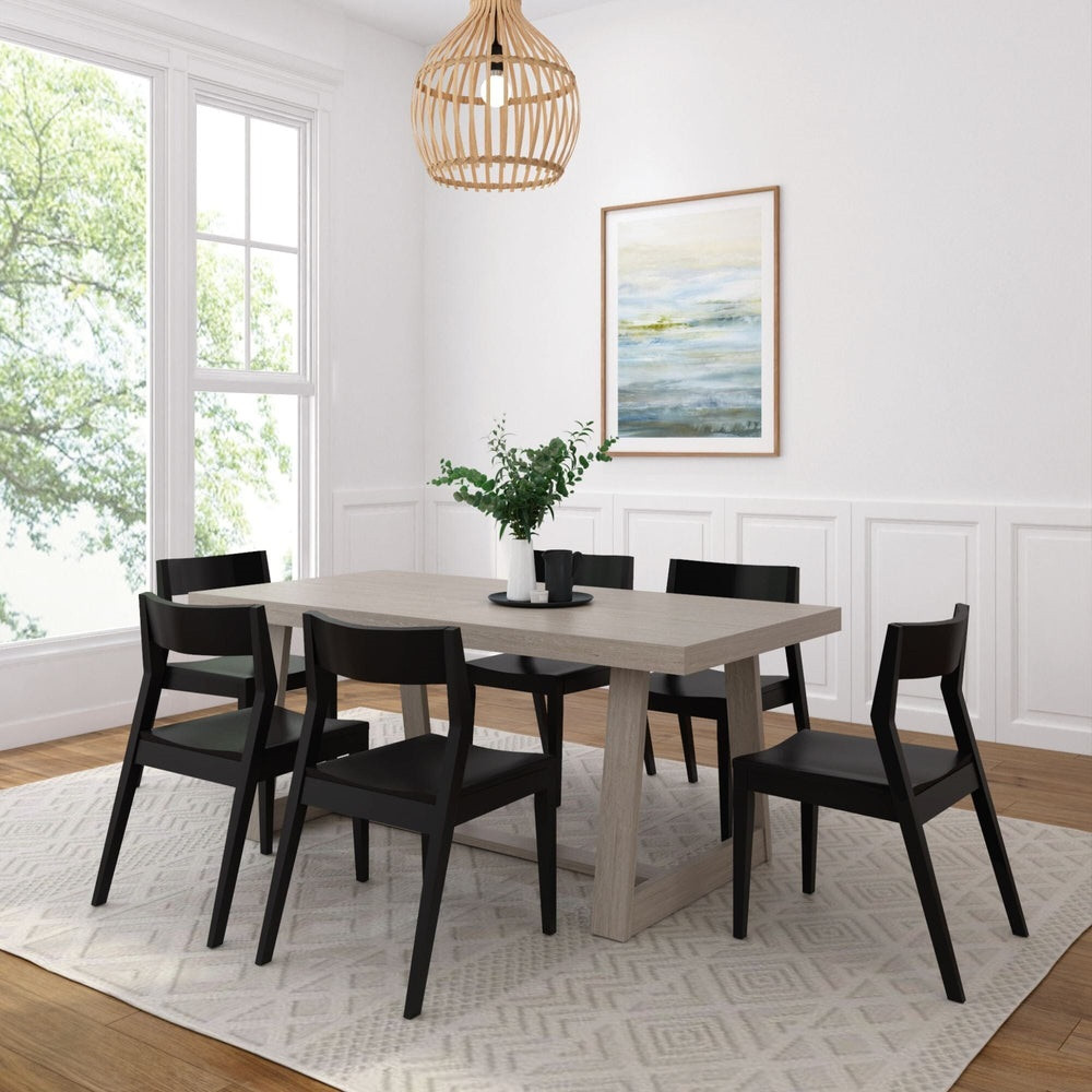 Riley Wirebrush Seashell Dining Room Table and Chairs Angled View shown with Black Chairs Room