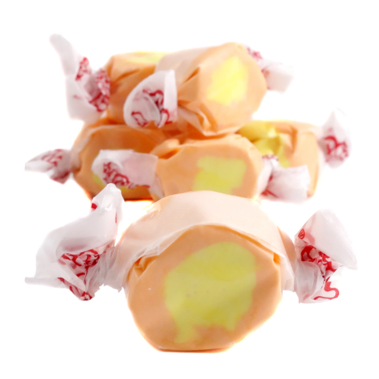 Mango Salt Water Taffy, approximately 65 vibrant yellow-orange pieces per pound. Creamy, sweet, and tart.