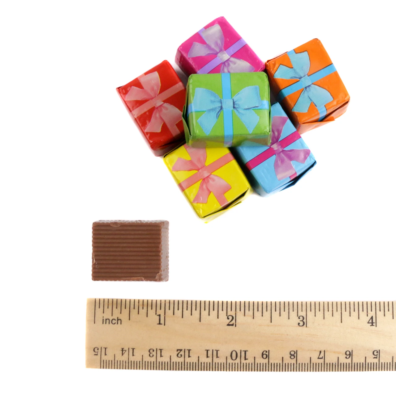 Madelaine Chocolate solid milk chocolate cubes, brightly colored foil-wrapped mini presents, approximately 48 pieces per pound.