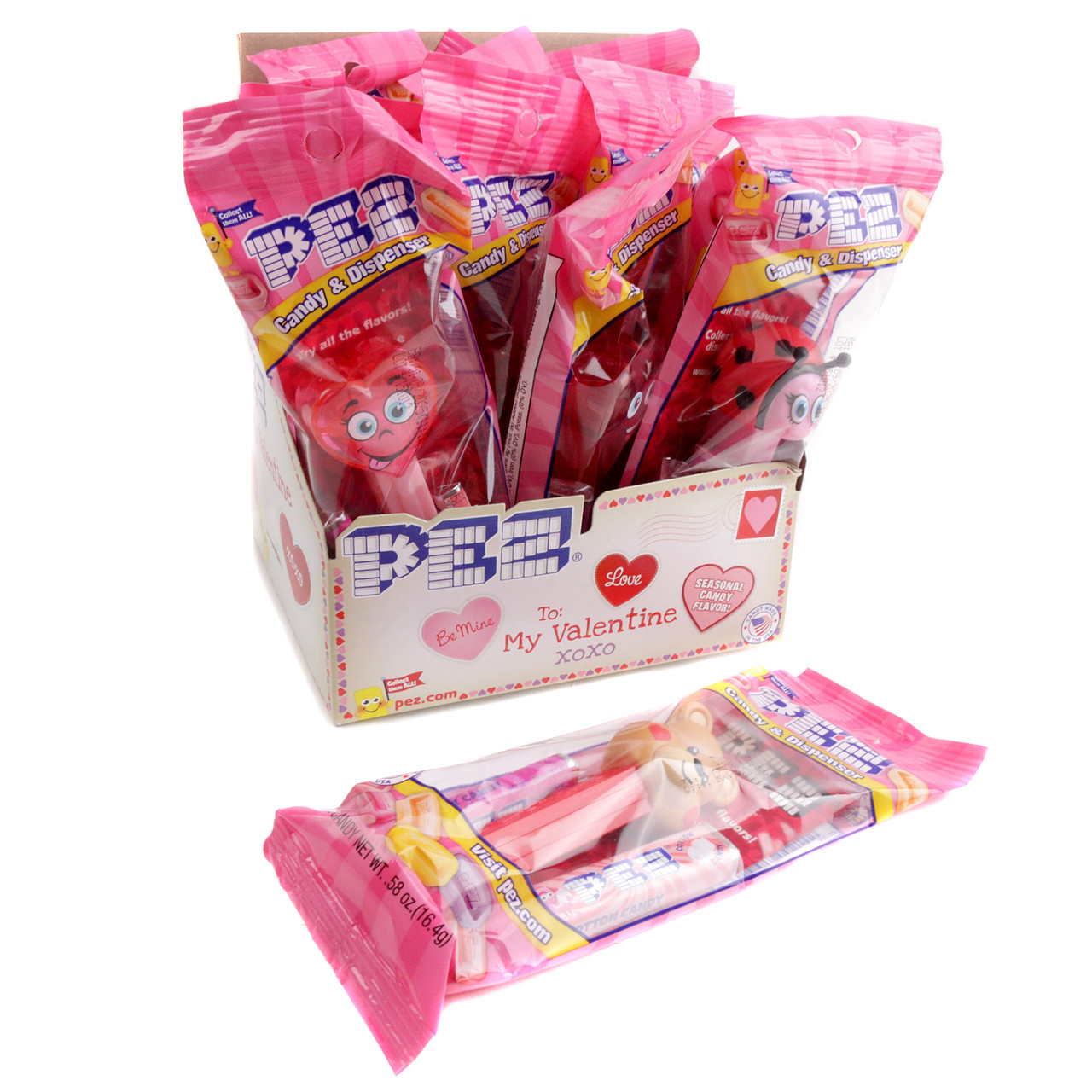 12 individually wrapped Pez Valentine candy dispensers, red, pink, white, heart-themed, with 3 refill packs each.