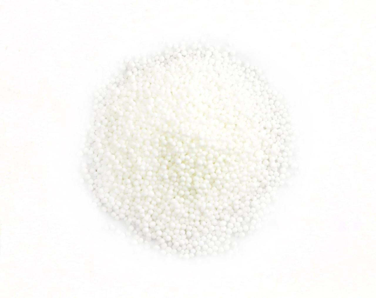 Pile of white Nonpareil Sprinkles, tiny confectionary balls for baking, dessert toppings. USA made by Sprinkle King.