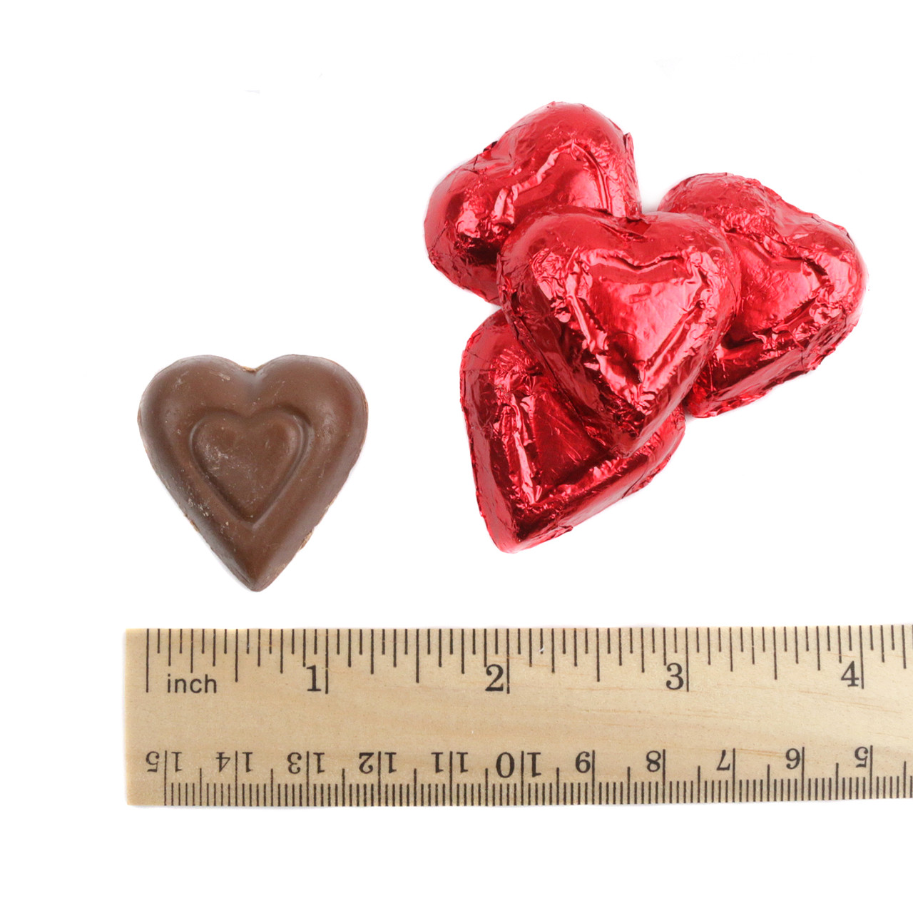 Red mini milk chocolate hearts, individually foil-wrapped in bright red, approx. 55 per pound. Perfect Valentine's Day candy.