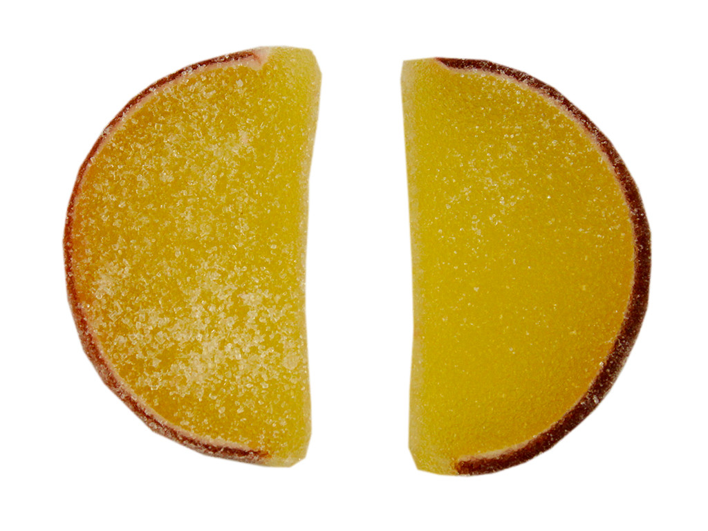 Bright yellow pineapple jelly candy fruit slices, unwrapped, tropical flavor, 5LB bulk box.