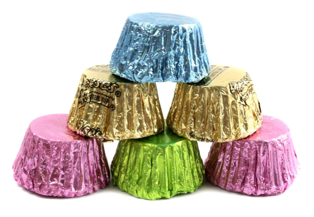 Mini Hershey Reese's Peanut Butter Cups, 48 per pound, wrapped in beautiful pastel foils. Smooth milk chocolate, creamy peanut butter.