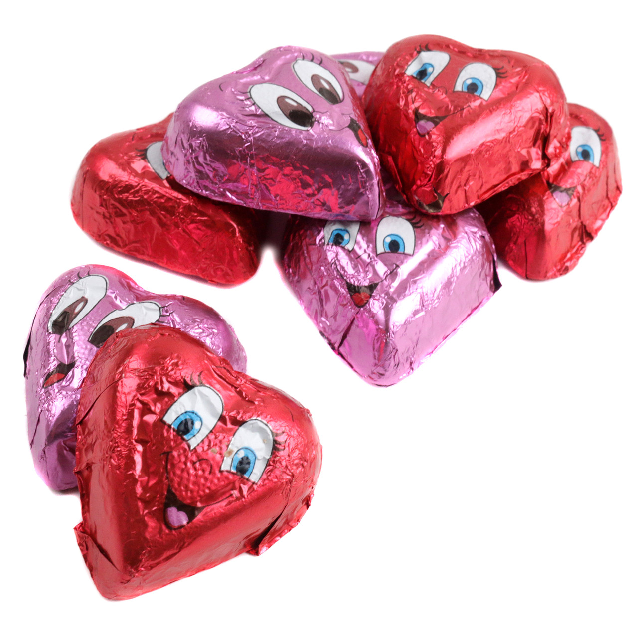 Individually wrapped bright red and pink foil Valentine chocolate hearts, each with different expressions. Approx 47 per pound.