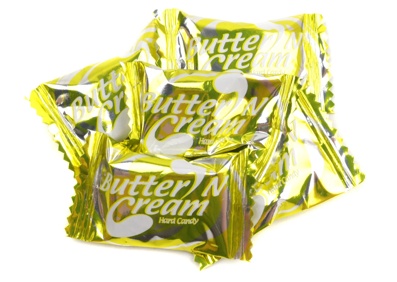Multiple Colombina Butter Toffee Hard Candies, individually wrapped in elegant gold foil. Buttery toffee hard candy.