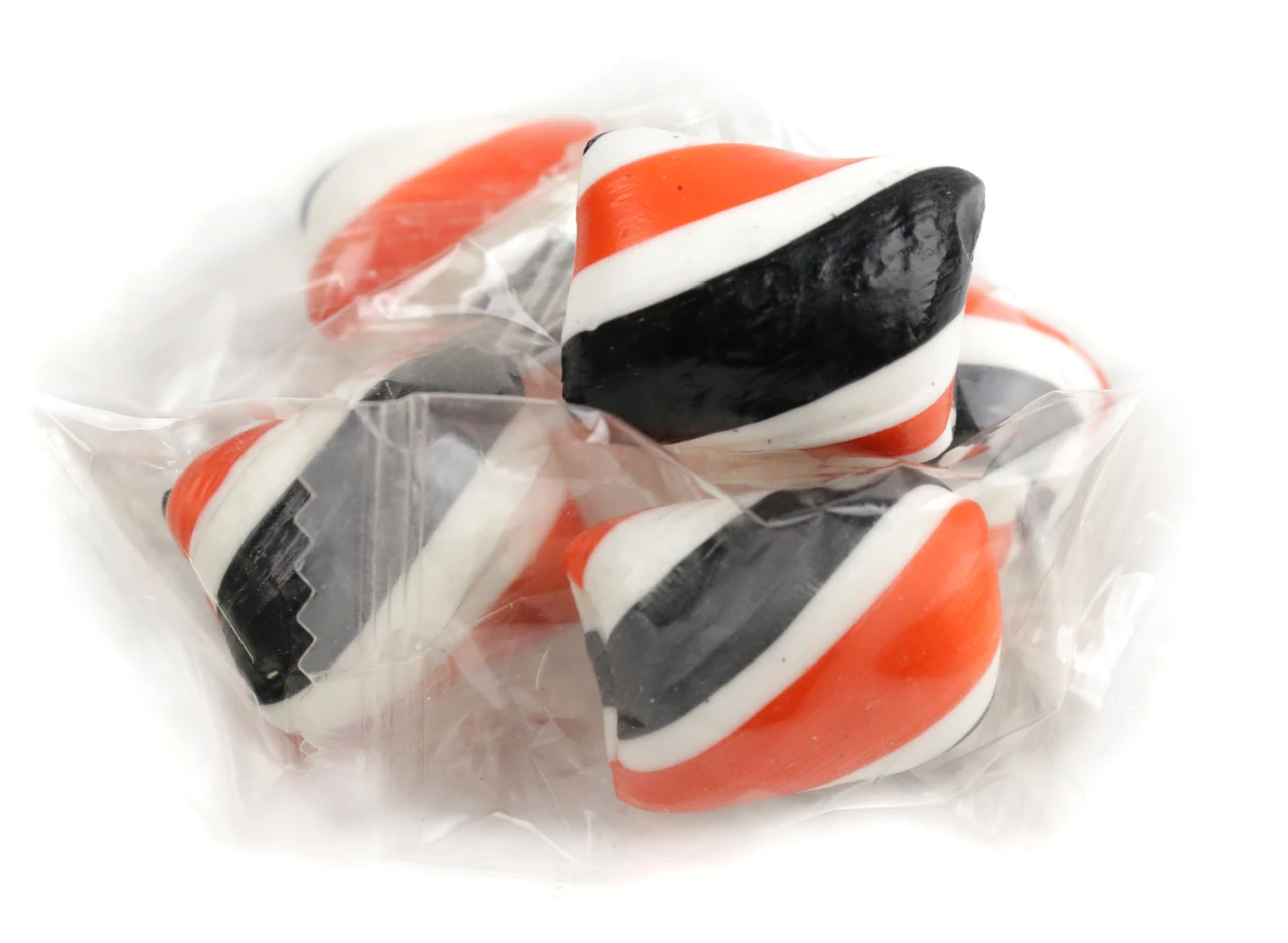 Vibrant orange and black Halloween hard candy twists, individually wrapped, citrusy orange flavor, approx 93 pieces.