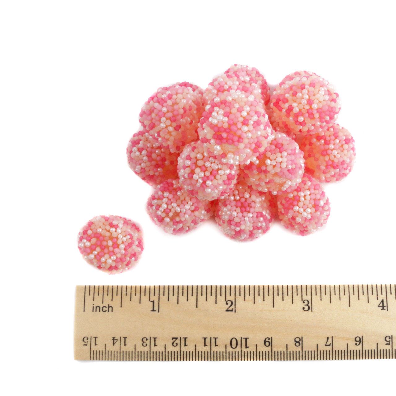 Pink nonpareil gummy berries, strawberry taste, covered in pink & pearly white nonpareils, approx. 100 per pound.
