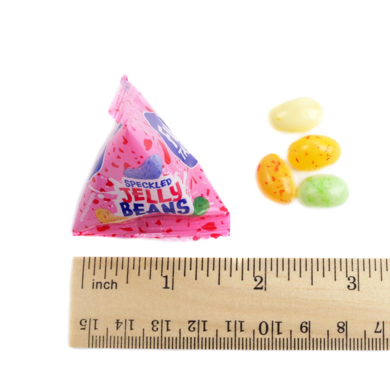 Individually wrapped speckled jelly beans in pyramid bags, vibrant assorted fruit flavors.