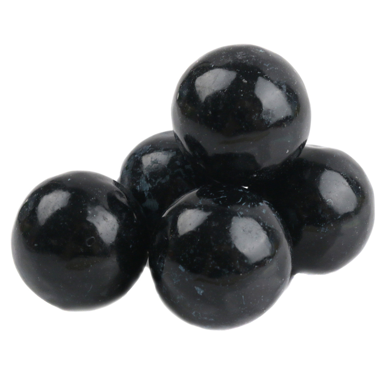 Numerous striking black tutti frutti gumballs, uniform single color, round candy.