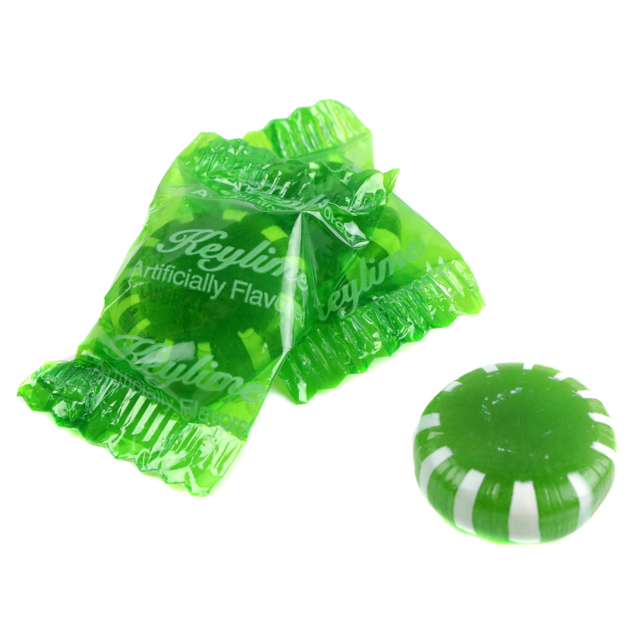 Bright green, smooth Key Lime hard candy discs, individually wrapped by Sunrise.