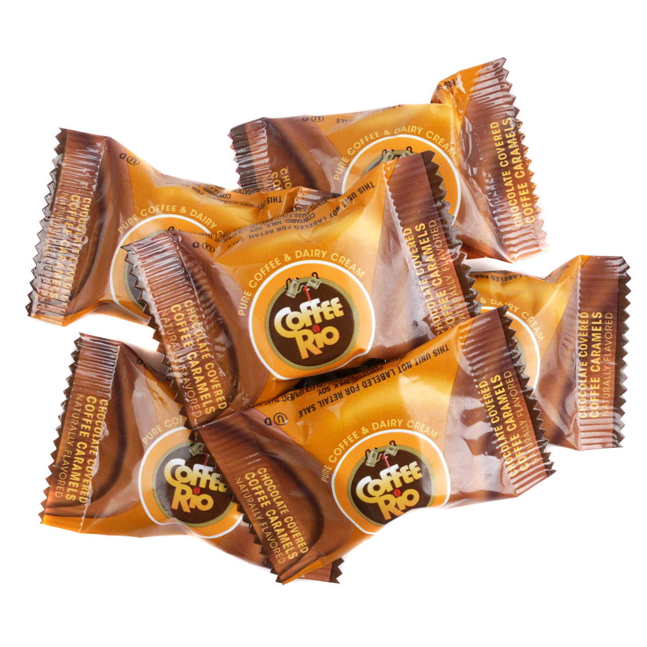 Bulk heap of individually wrapped Coffee Rio chocolate covered coffee caramels in brown foil wrappers.