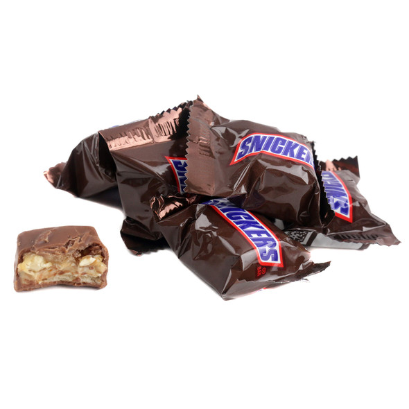 Many Snickers Mini bite-sized candy bars, milk chocolate covered, with golden caramel, white nougat, and peanuts