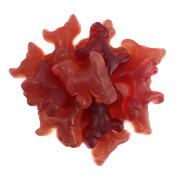 Pile of red licorice beagles, cute gummy dog candy from Holland. Cherry, strawberry, black currant flavors.