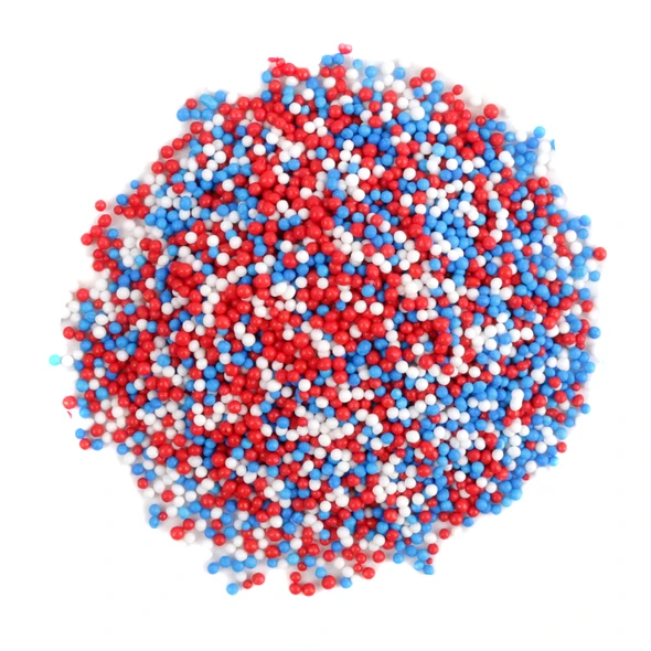 Red, white, and blue patriotic nonpareil sprinkles, tiny confectionery balls, 4th of July dessert topping.