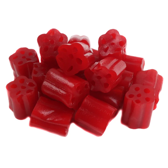 Kenny's Cherry Honeycomb Licorice Bites, vibrant red, chewy, many unwrapped bite-sized pieces.