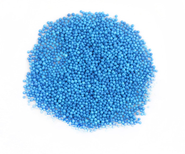 Bright blue nonpareil sprinkles, tiny confectionary balls for baking, cookies, cupcakes, ice cream, dessert toppings.