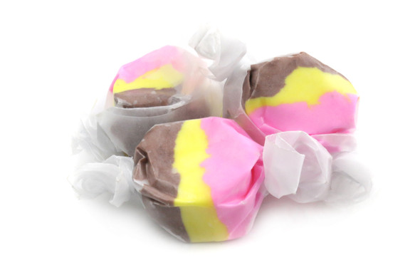 Bright yellow Banana Split Salt Water Taffy, 60 pieces per pound. Chewy banana, chocolate, strawberry flavors.