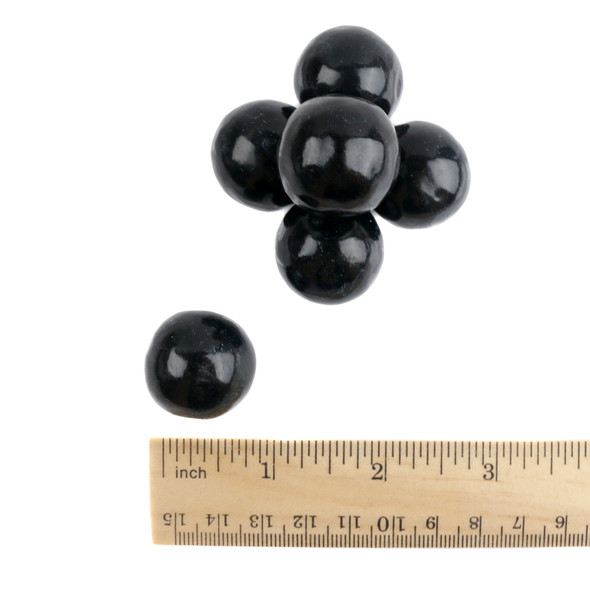 image of black gumballs