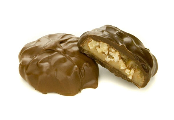 Ashers Milk Chocolate Pecan Caramel Patties, approximately 23 brown patties, showing gooey caramel and crunchy pecans.
