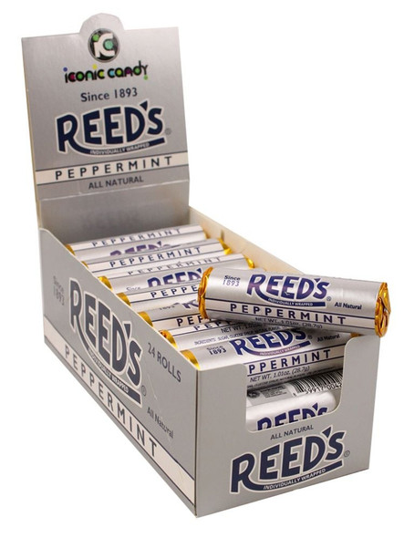 Bulk box of 24 white Reeds Peppermint hard candy rolls, each containing 7 classic round white candies.