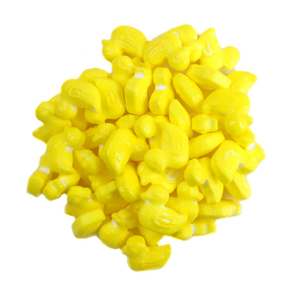 Many bright yellow pressed candy rubber ducks, 3/4 inch each, approx 310 per pound, for baby showers.
