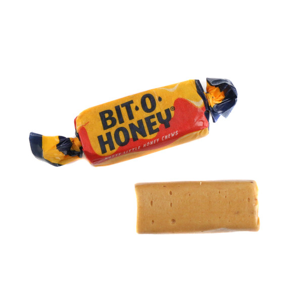 Golden Bit O Honey chewy candy, bite-sized square taffy with real honey & roasted almonds, approx. 60 pieces per pound.