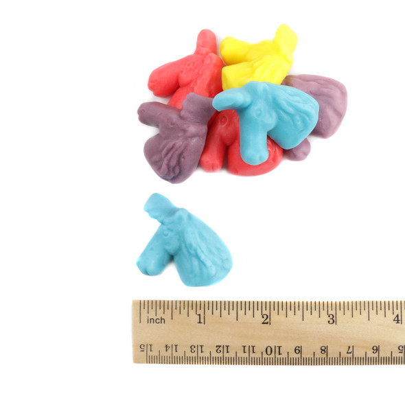 Pastel unicorn gummies, 65 per pound. Grape-purple, strawberry-pink, lemon-yellow, raspberry-blue fruity candy.