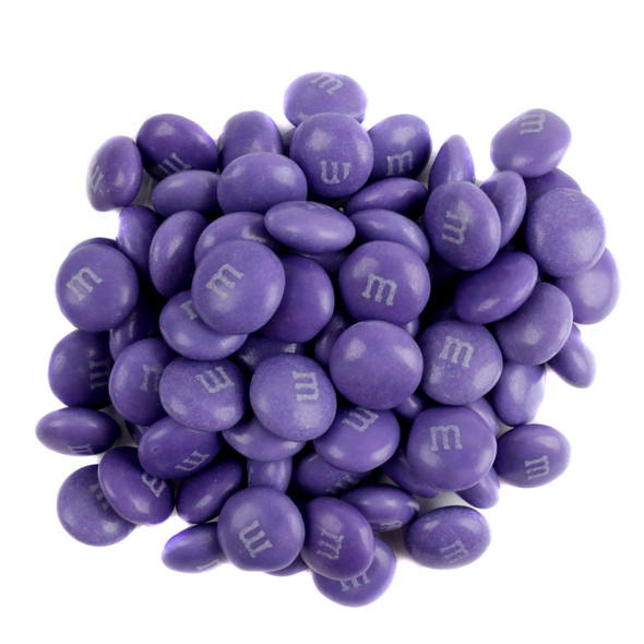 Vibrant purple M&M's candy, approximately 500 pieces per pound, displayed in bulk for candy buffets and parties.