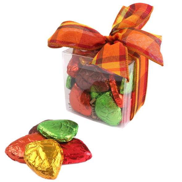 Half-pound cube of Madelaine solid brown chocolate Fall leaves tied with a festive autumn bow.