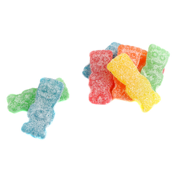 Large unwrapped Sour Patch Big Kids, colorful pile of red cherry, green apple, orange, yellow lemon sour gummies.