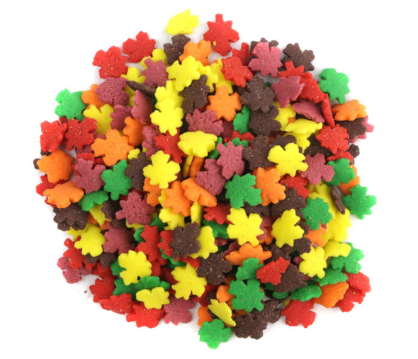 Assorted colorful Fall Leaves Sprinkles, delicate autumn leaf shapes in red, orange, yellow, brown, for decorating baked goods.